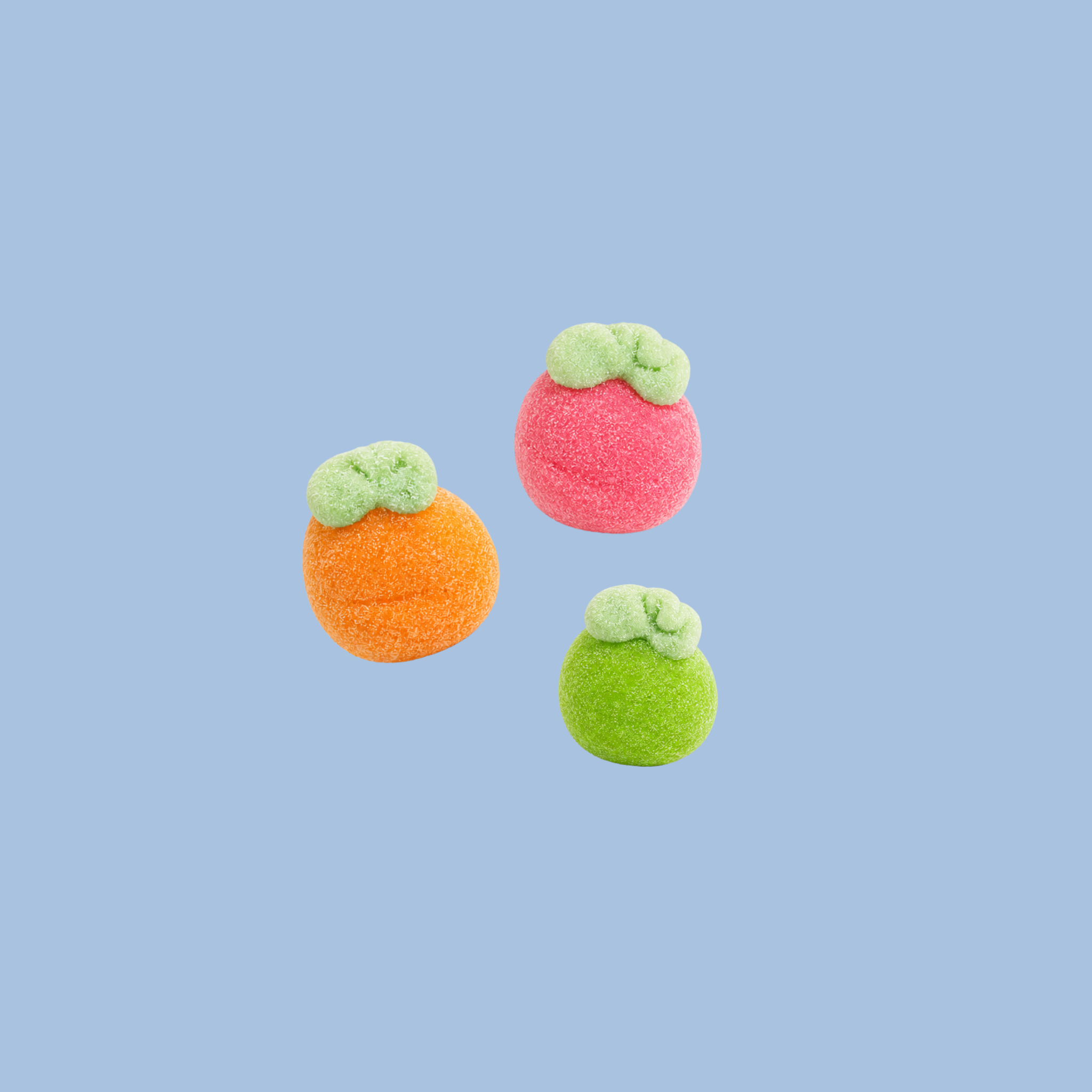 Three colorful felted fruit toys on a light blue background