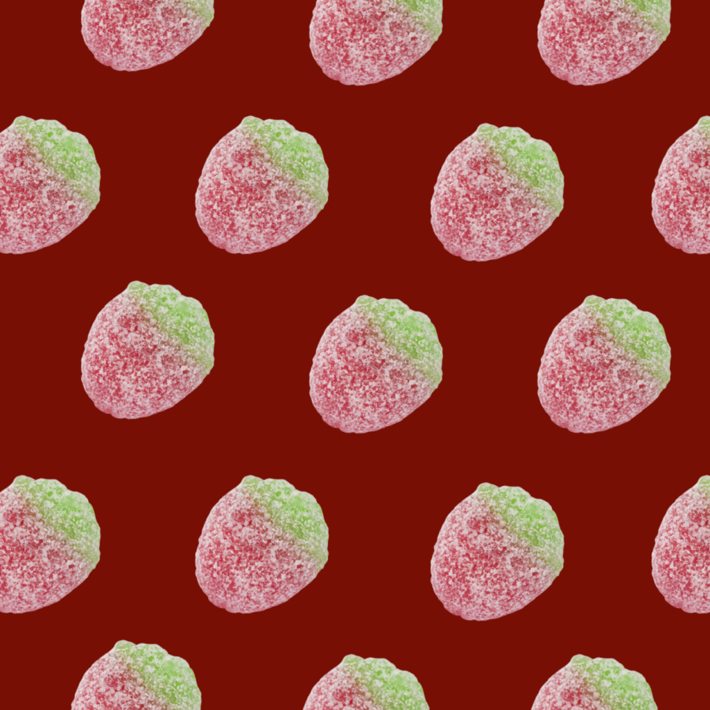 Pattern of red and green gummy candies on a red background