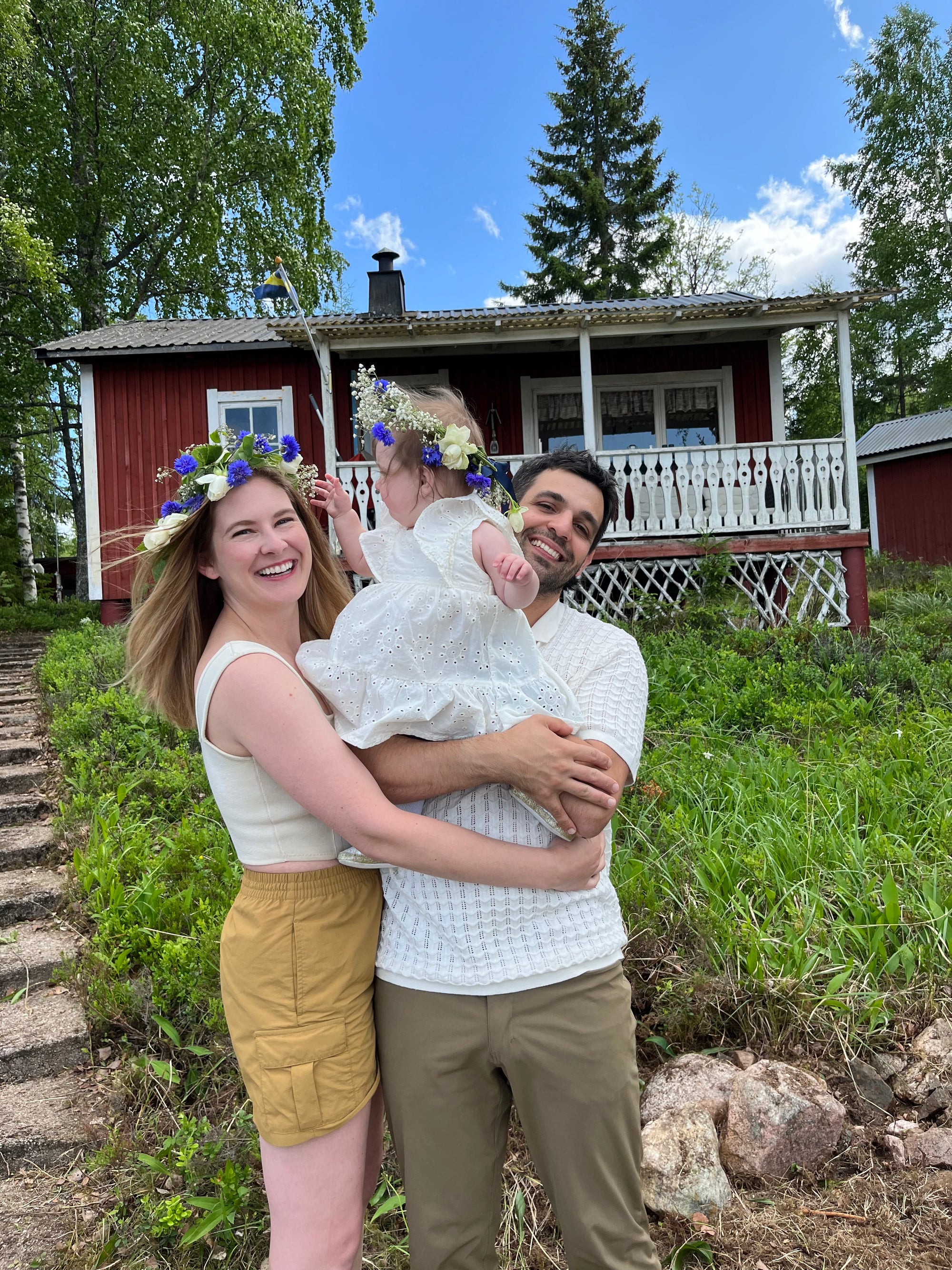 lilla swedish candy founders front of a swedish cabin with greenery around