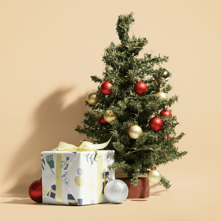 Decorated Christmas tree with ornaments and the lilla swedish candy gift box on a beige background