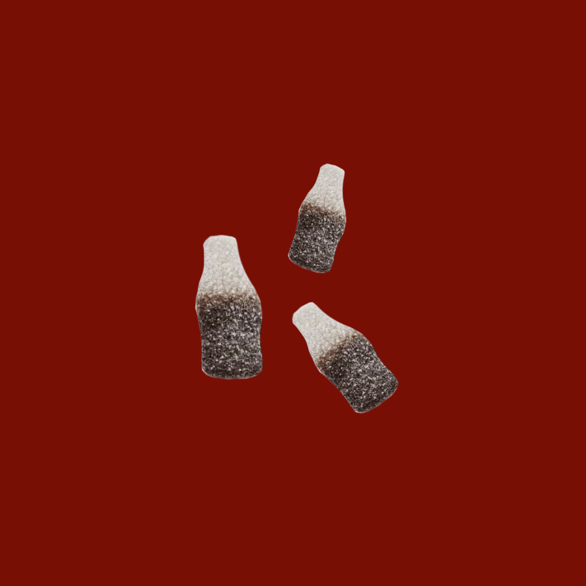 Three small bottles with white caps on a red background