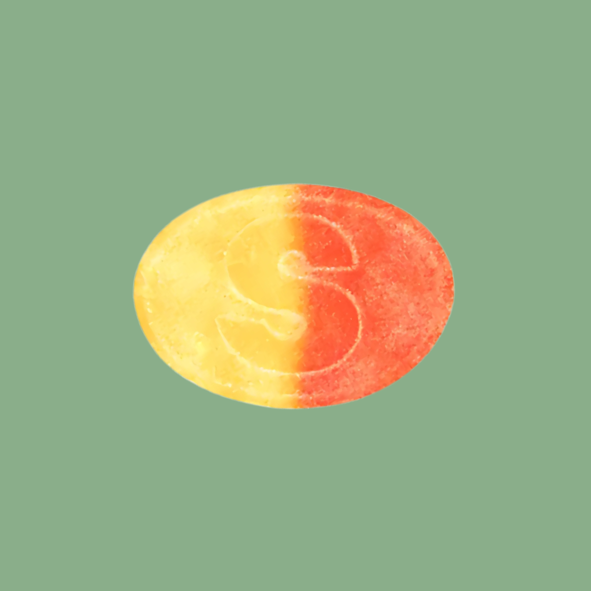 S-shaped candy on a green background
