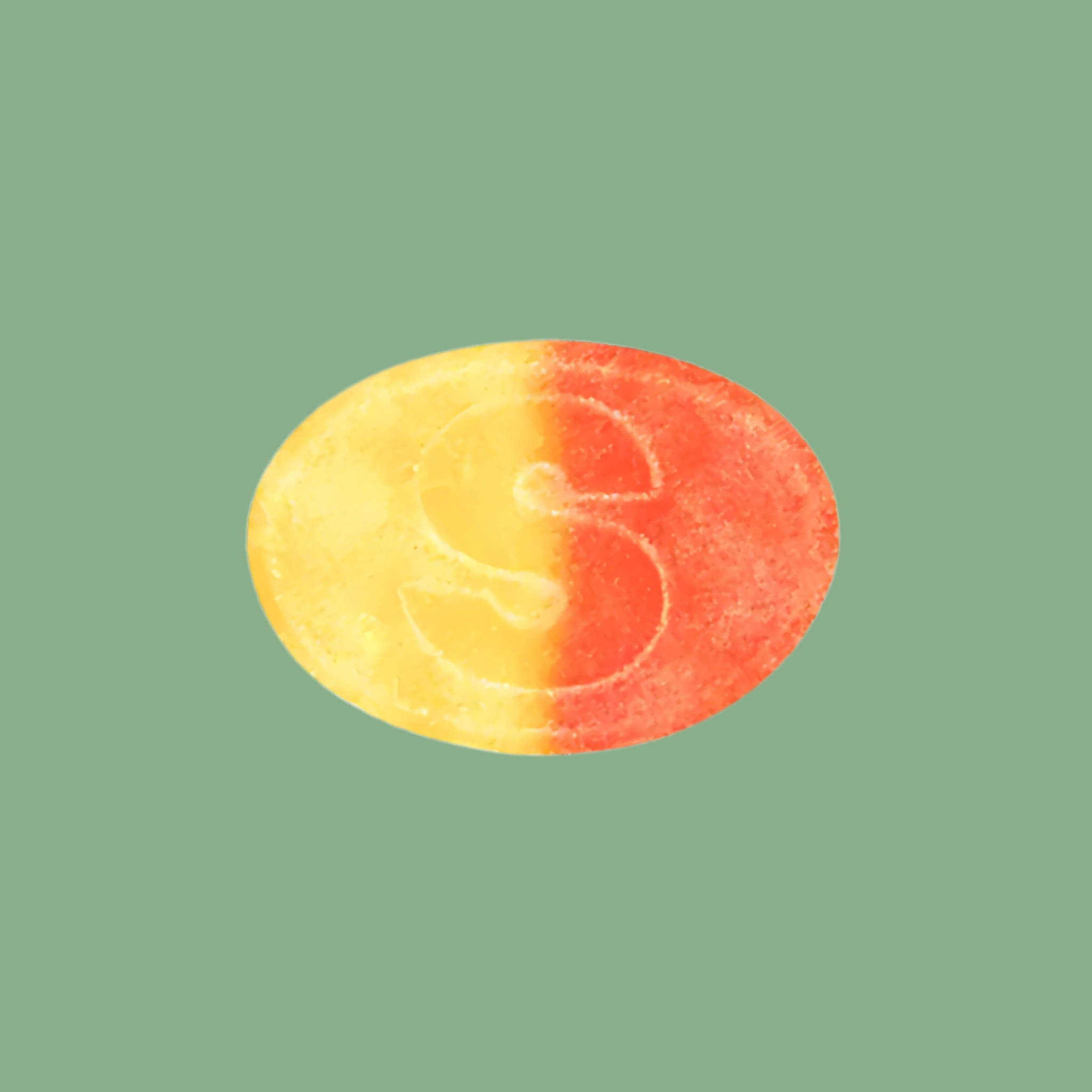 S-shaped candy on a green background